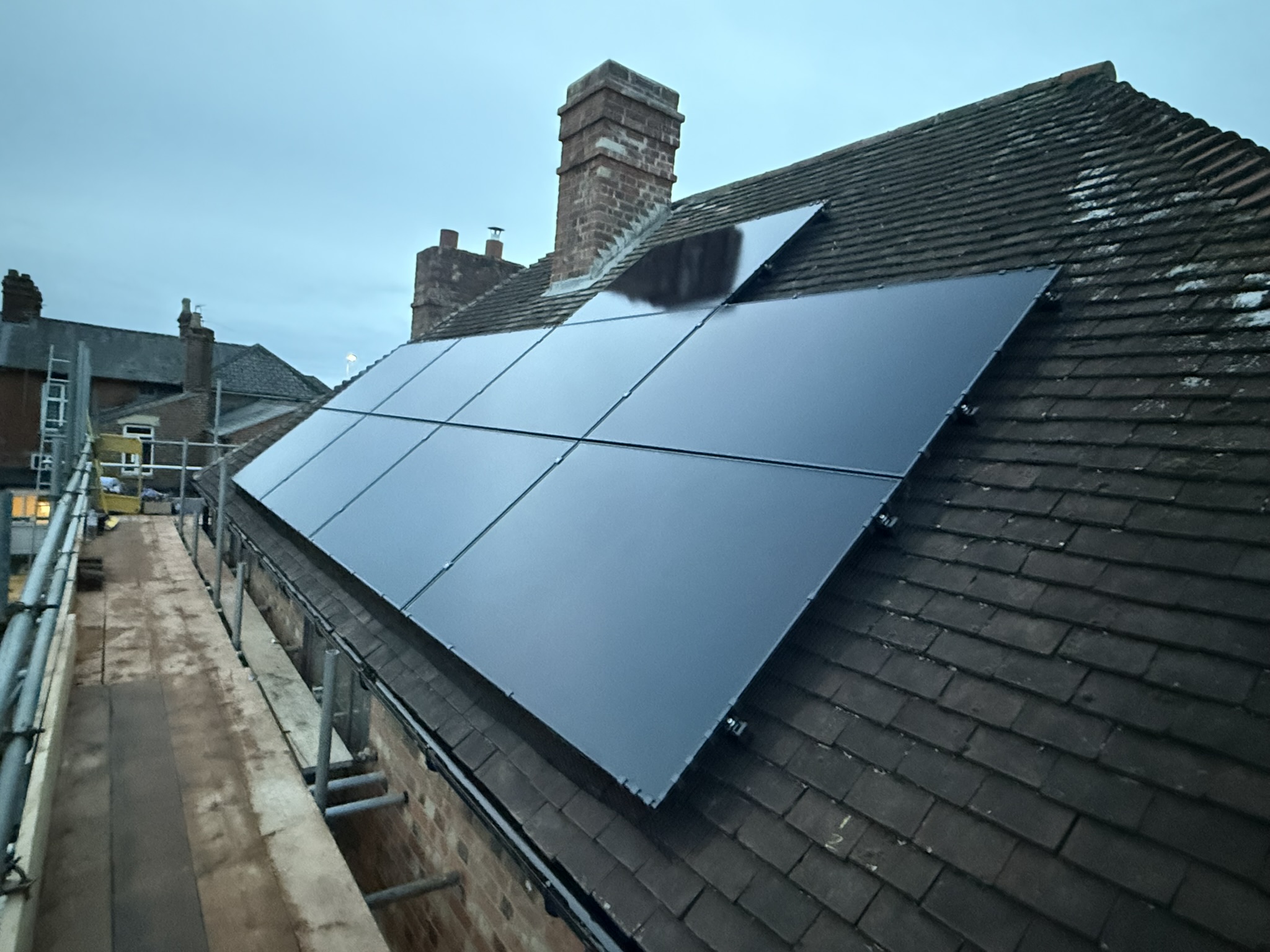Premium black solar panels installed on a UK residential property